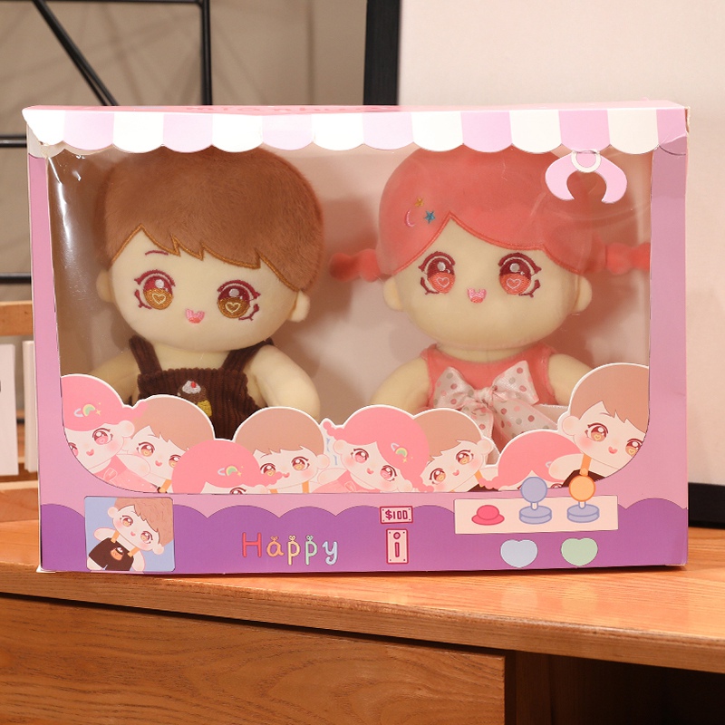 Coordinated human character plush pair presented together for sample review